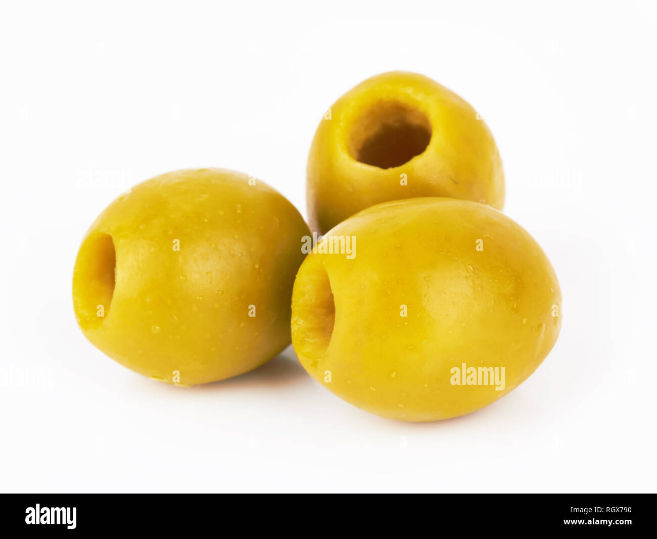 green olives isolated on a white background Stock Photo - Alamy