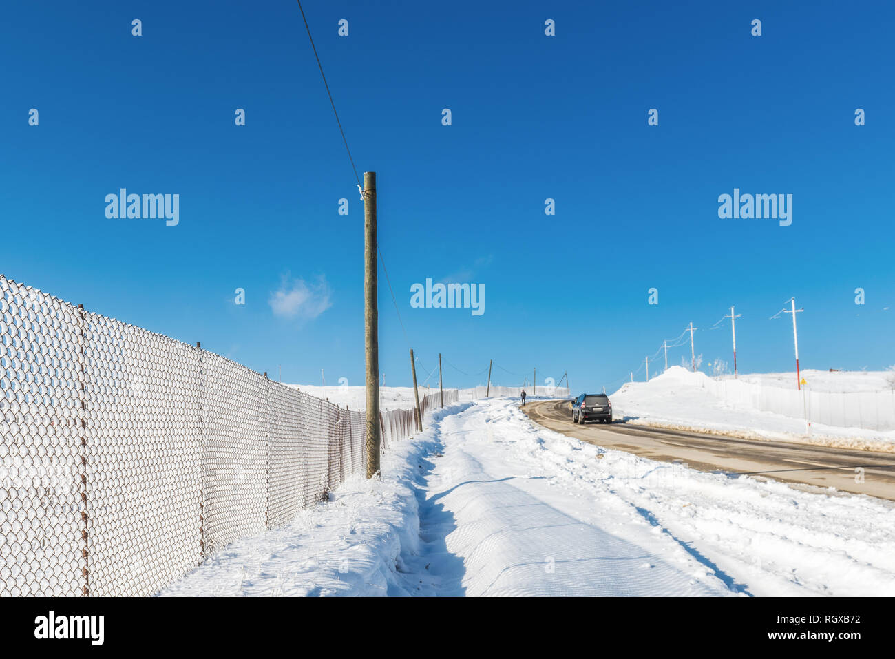 Snow fence along the road, winter scene Stock Photo