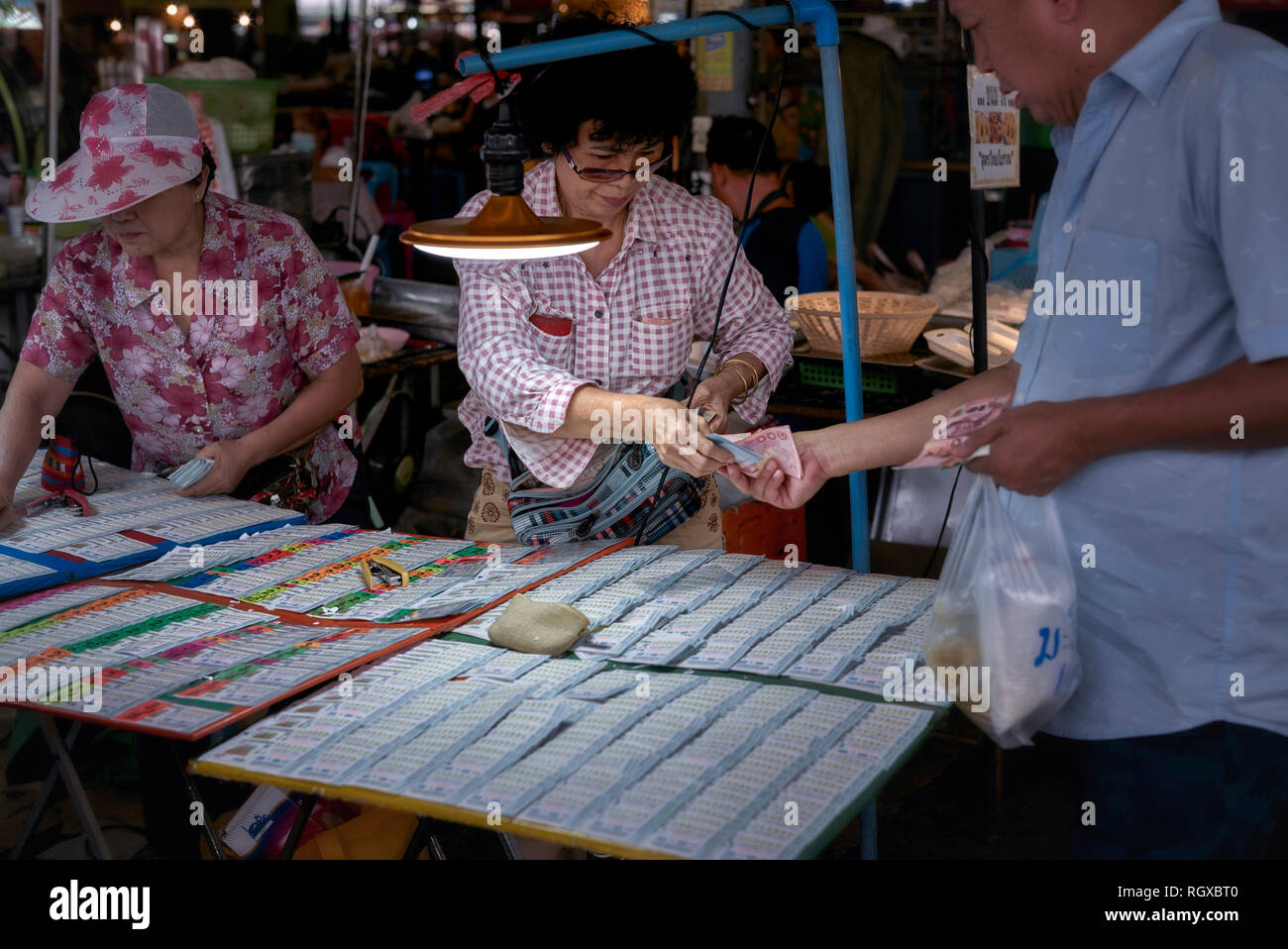 Thailand Lottery People Buying Lottery Tickets From A Female Lottery thailand-lottery-people-buying-lottery-tickets-from-a-female-lottery