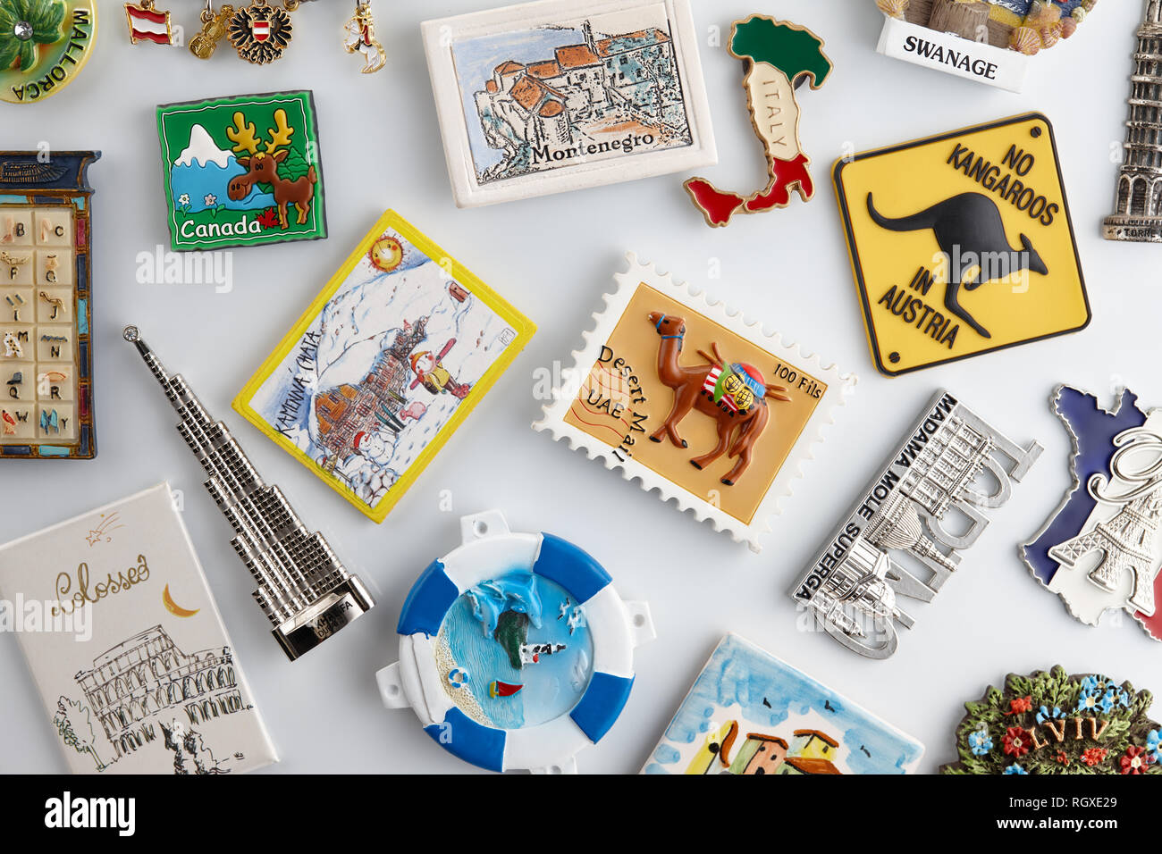 souvenirs from all around the world on white refrigerator