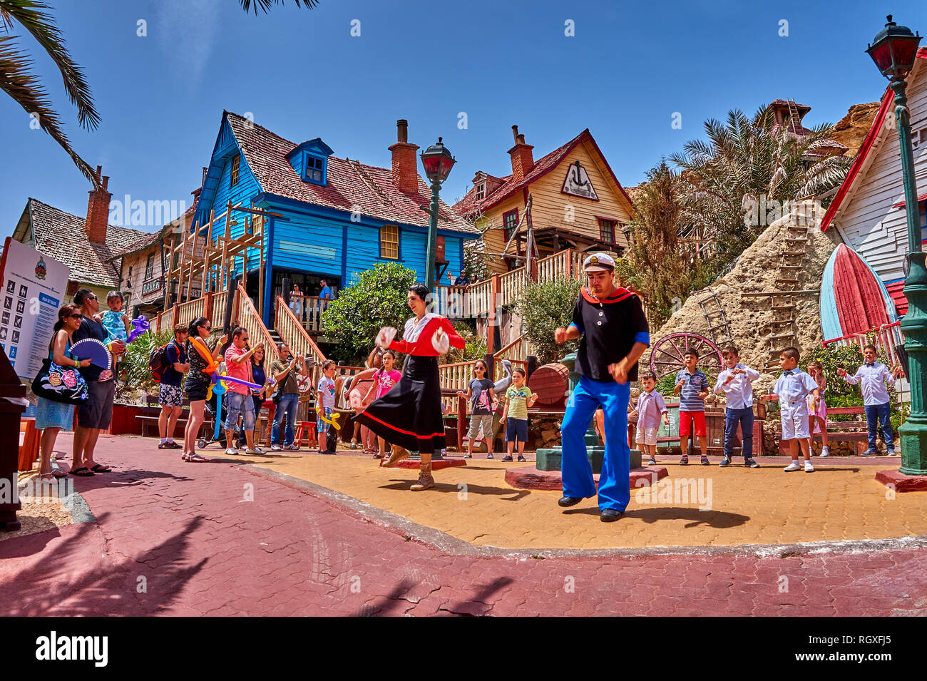 Entertainment dance street show at Popeye Village. Also known as Sweethaven Village, film purposely built, converted into a small tourist attraction. Stock Photo