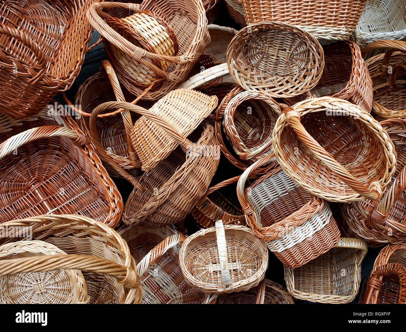 Pile of wicker baskets on sale in public street market Stock Photo Alamy