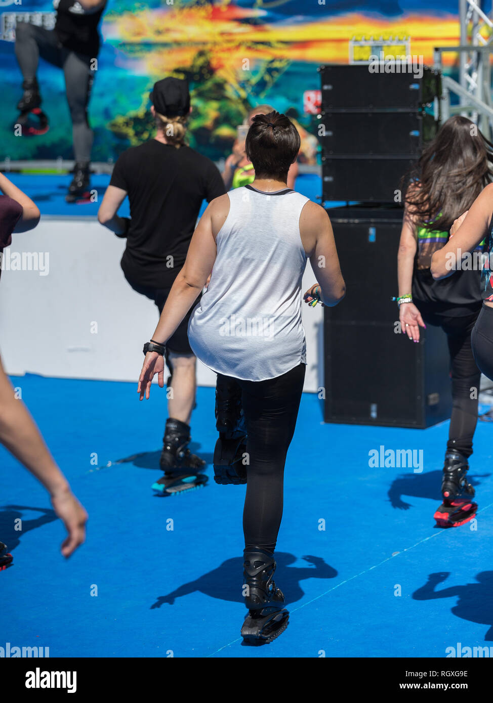 People in the Gym doing Fitness Exercises with Special Elastic and