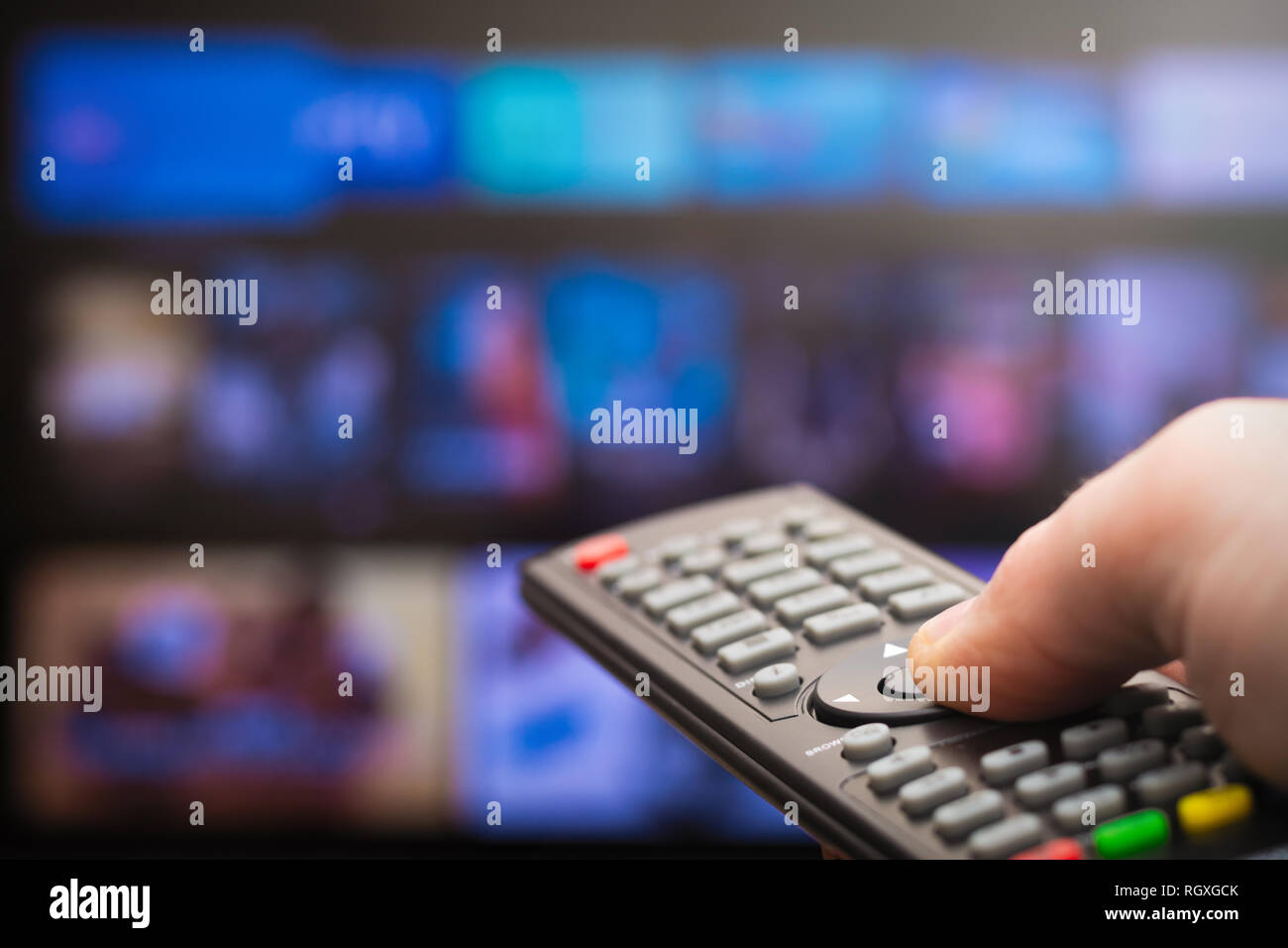 TV remote in hand Stock Photo - Alamy