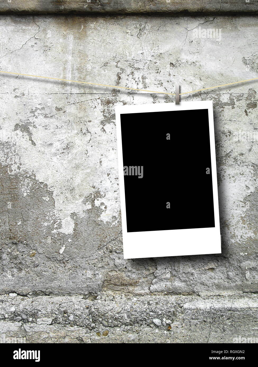 Blank rectangular photo frame against weathered concrete wall background Stock Photo