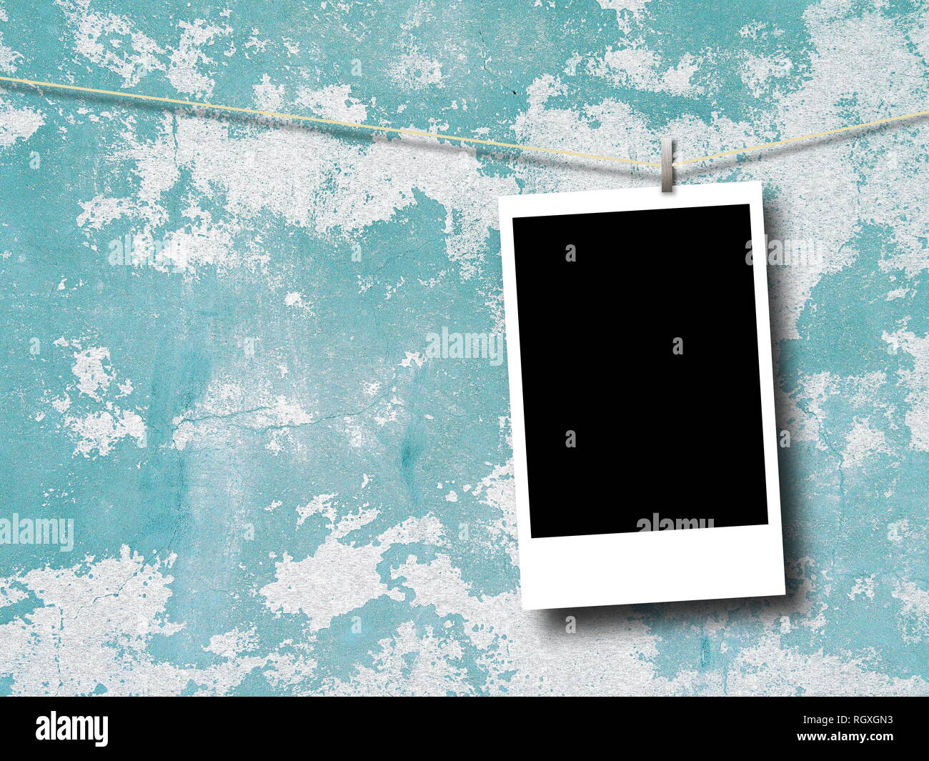 Blank rectangular photo frame against aqua and white scratched concrete wall background Stock Photo