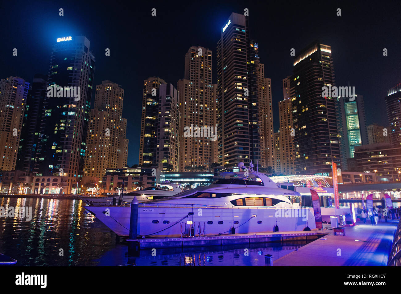 Dubai, United Arab Emirates - December 26, 2017: yacht club in Dubai Marina  district at night. Yacht boat on skyline with lighting. Water transport and  transportation. Travel or journey and trip Stock Photo - Alamy
