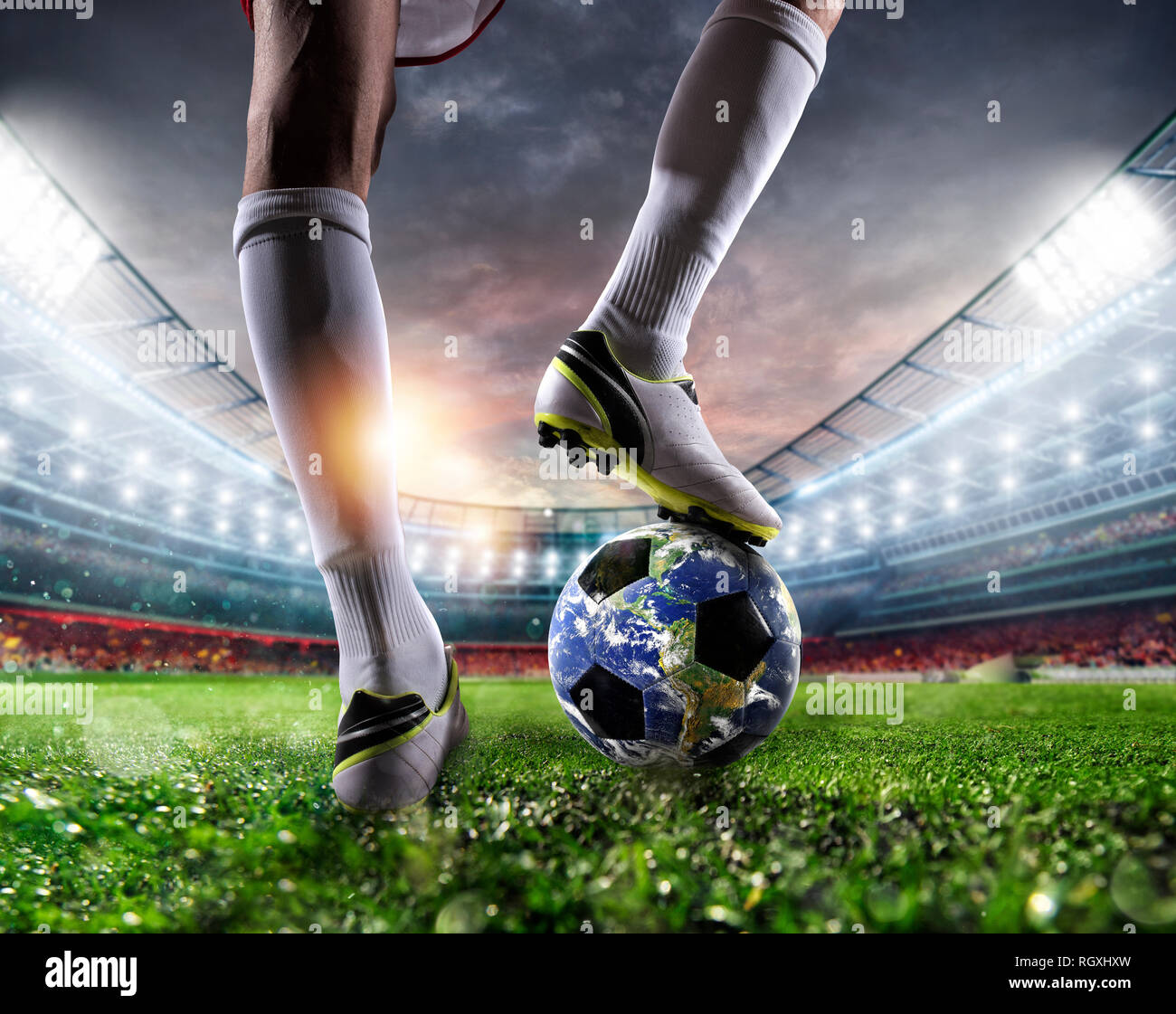 Player with a soccer ball a as world. Earth provided by NASA. Stock Photo