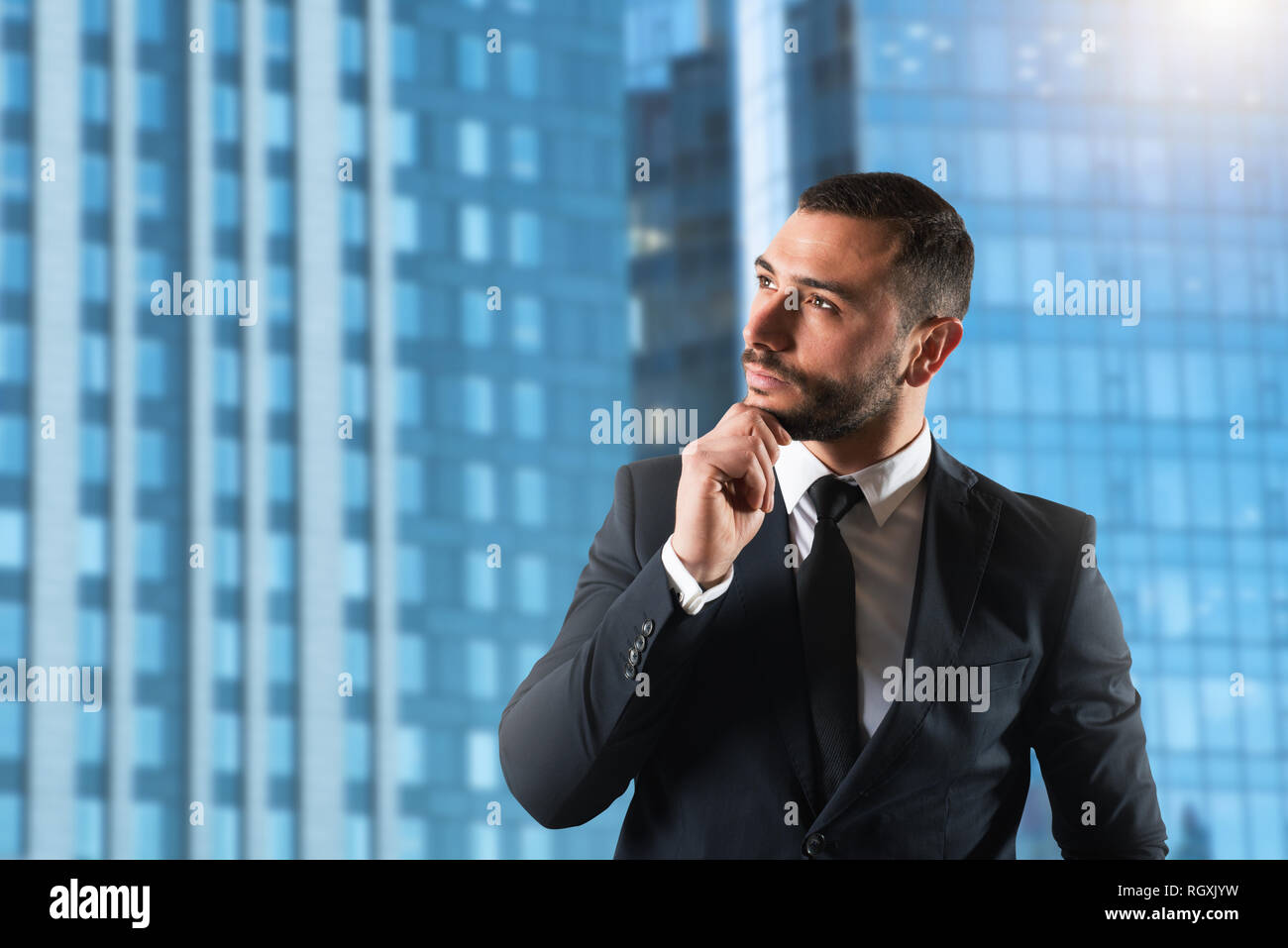 Businessman thinks new strategies to grow up the company Stock Photo
