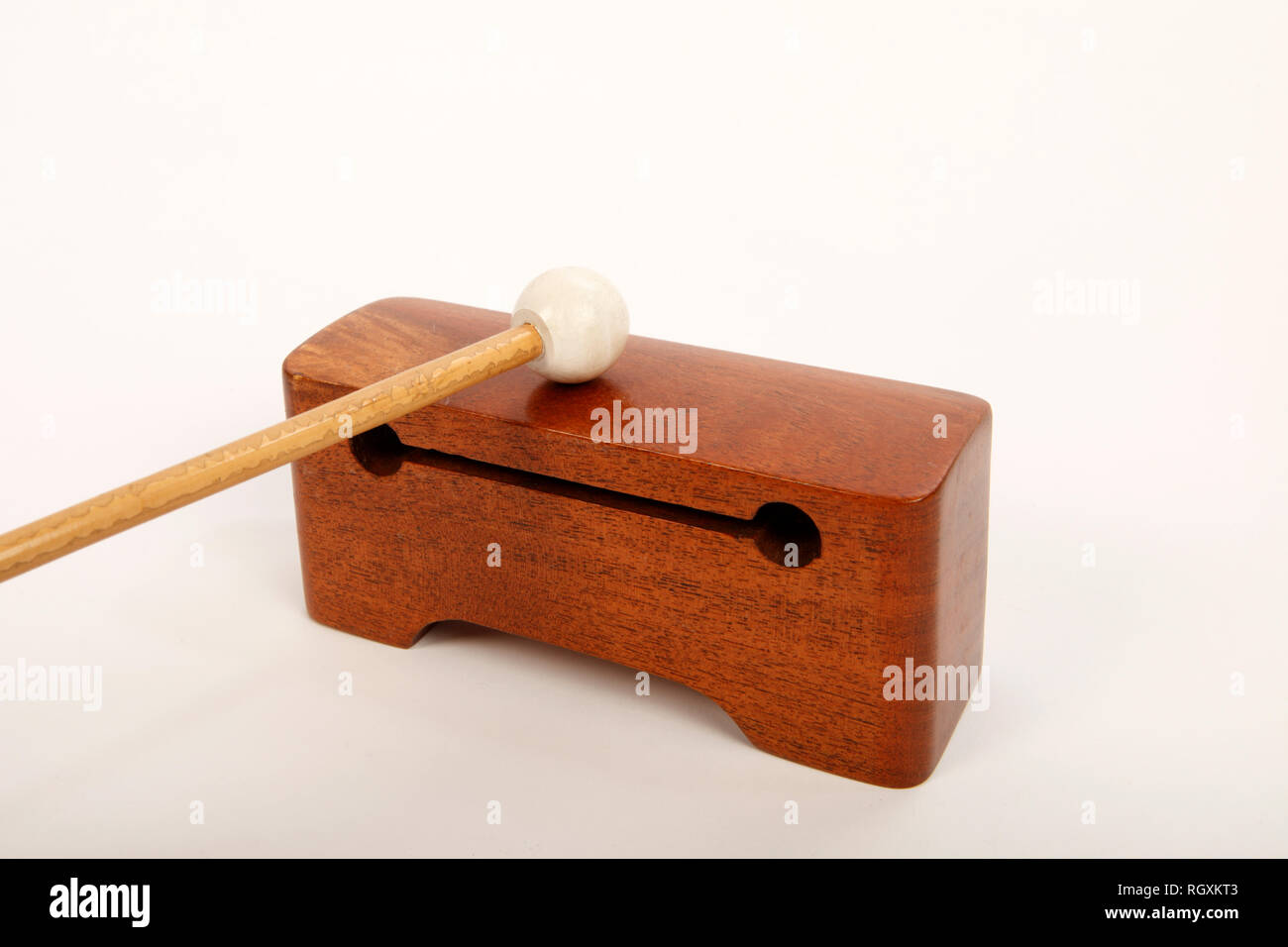 Piccolo rosewood hardwood wood block, with beater.. Percussion instrument. Stock Photo