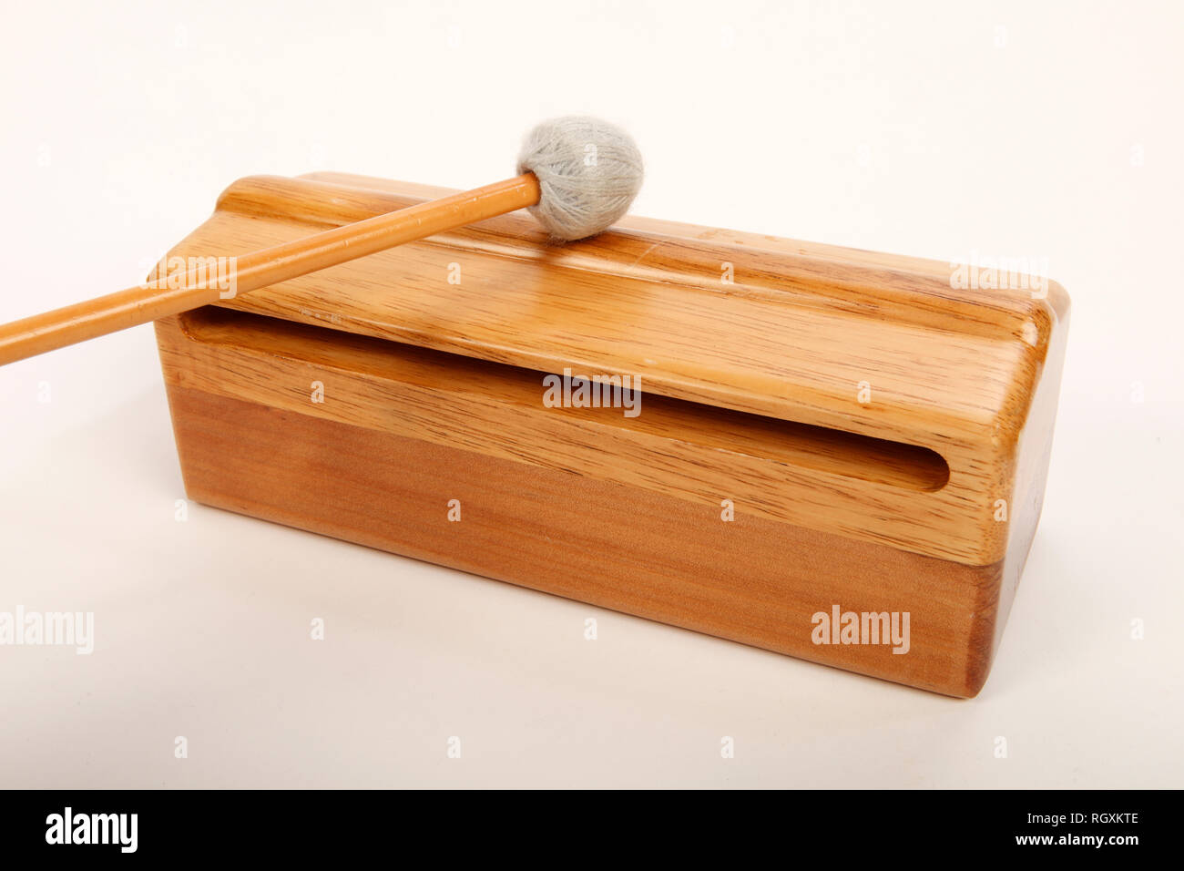 Large wooden hardwood Wood Block percussion instrument with a striking ridge. Stock Photo