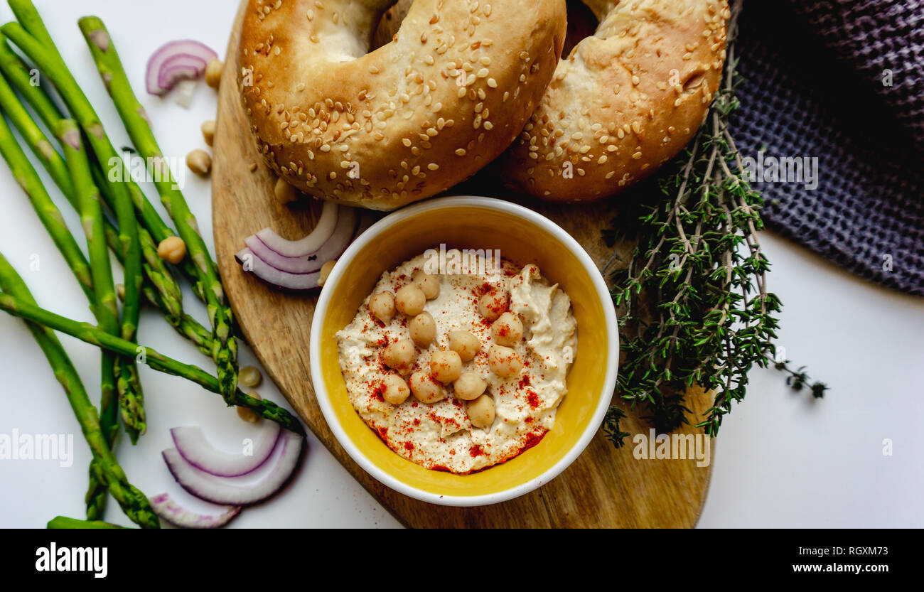 Bagel and hummus photographed from above Stock Photo Alamy