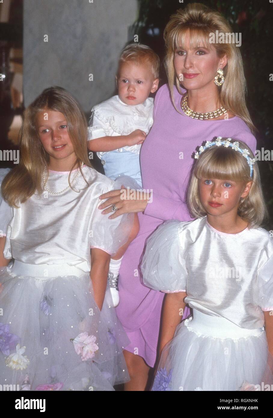 KathyHilton holding Baron Hilton II Nicki Hilton and Paris Hilton 1990
