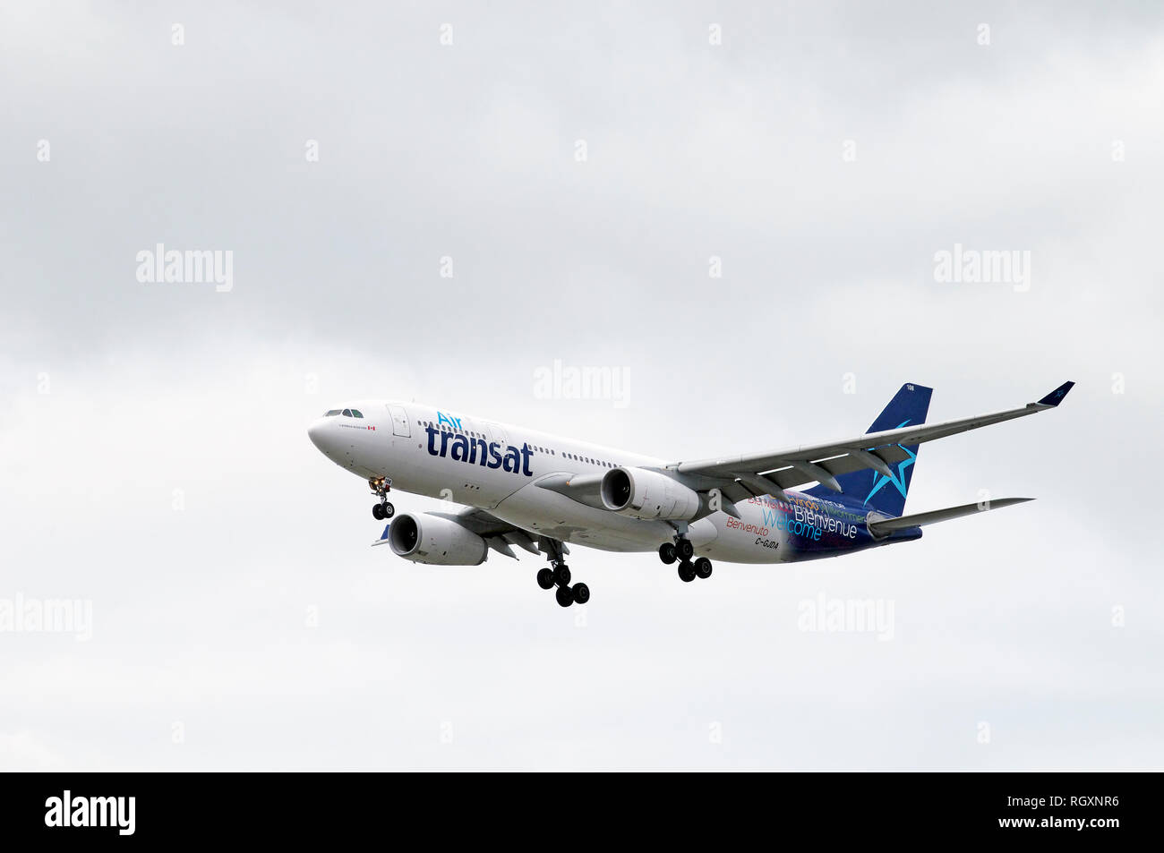 Air transat airplane coming into Vancouver International Airport landing wheels down ready for landing. Stock Photo