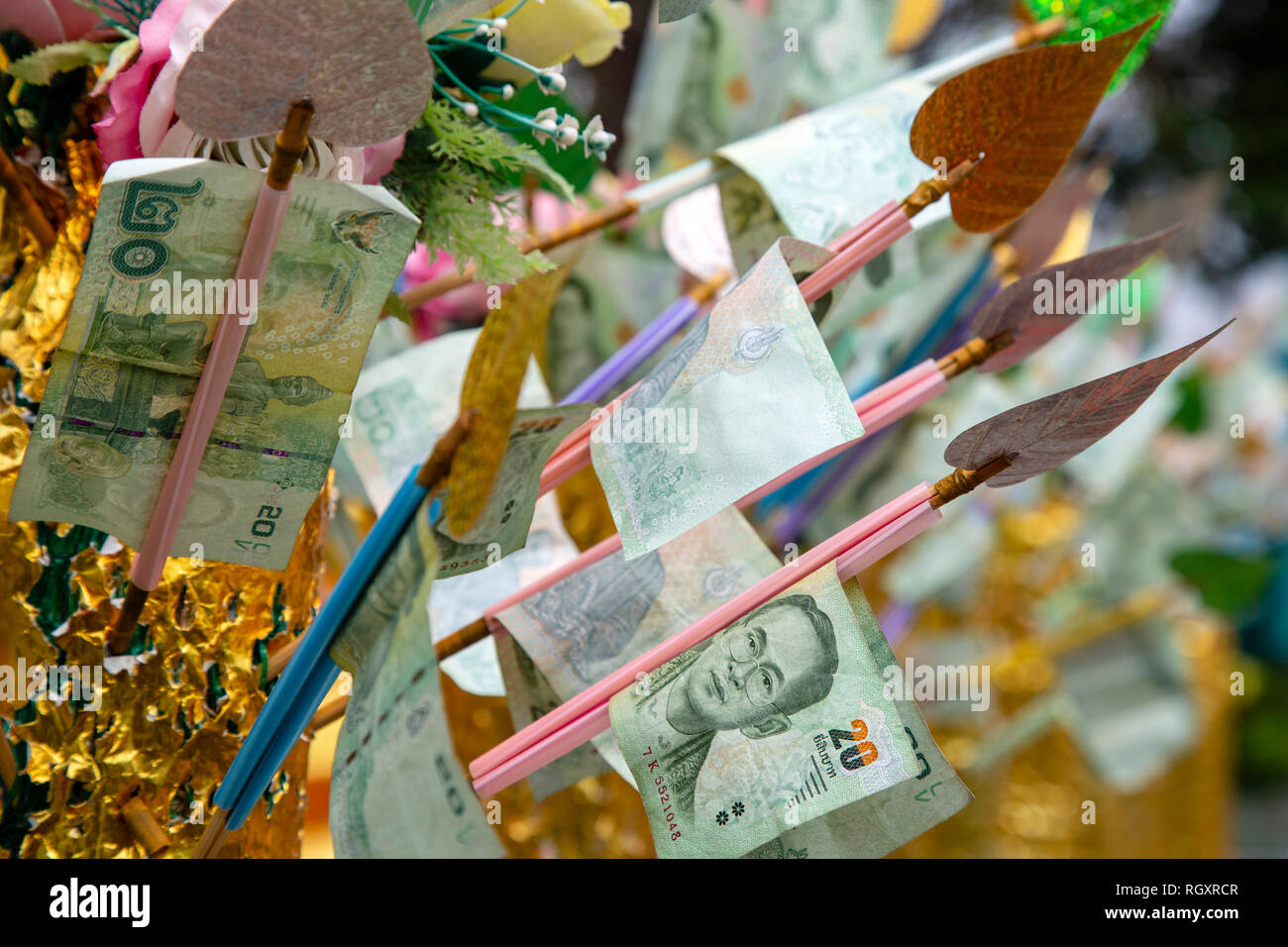 An Arrangement Of Thai Currency On A Money Tree Donated As A - an arrangement of thai currency on a money tree donated as a religious offering at wat phra yai located on pratumnak hill in pattaya thailand