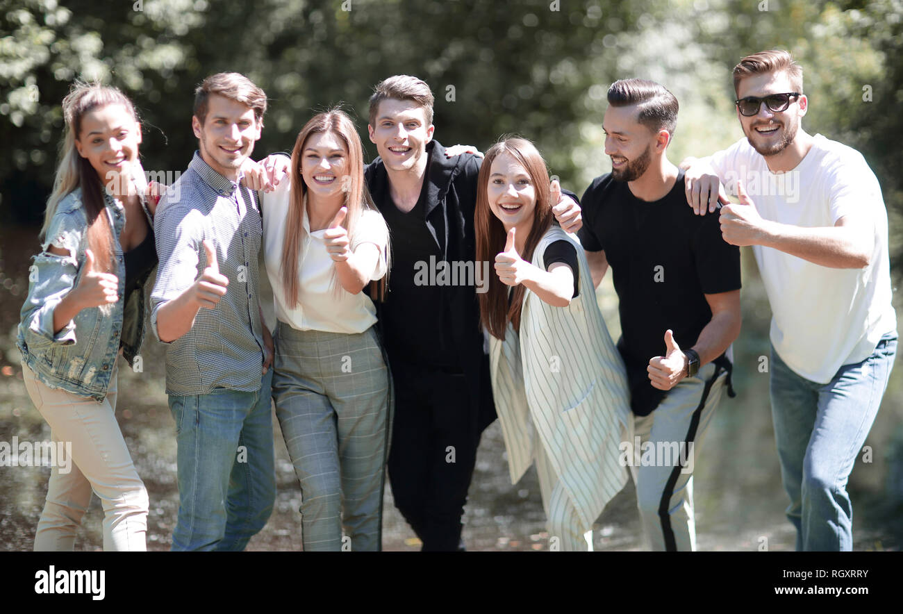 group of successful young people showing thumb up Stock Photo - Alamy