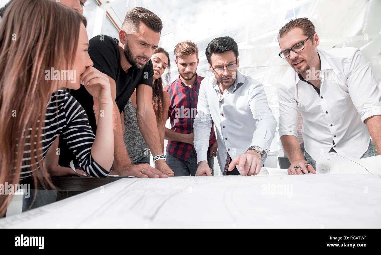 team of architects standing near the desktop Stock Photo