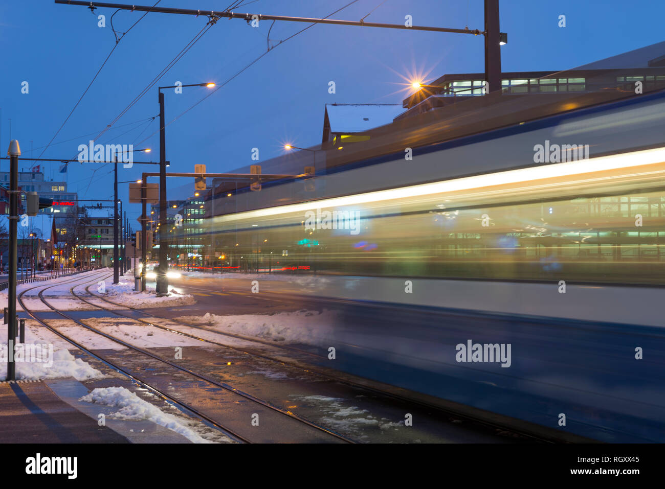 Tram in Motion Blur in Winter in Zurich, Switzerland. Stock Photo