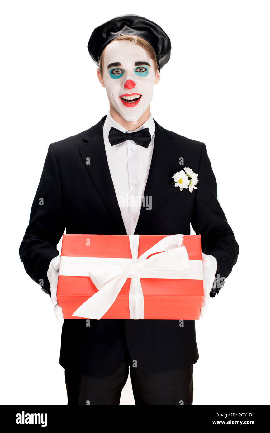Happy male clown holding present hi-res stock photography and images ...