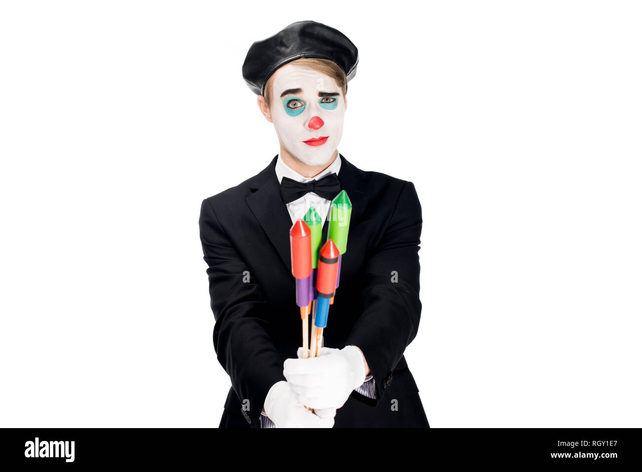 clown in suit holding firecrackers isolated on white Stock Photo