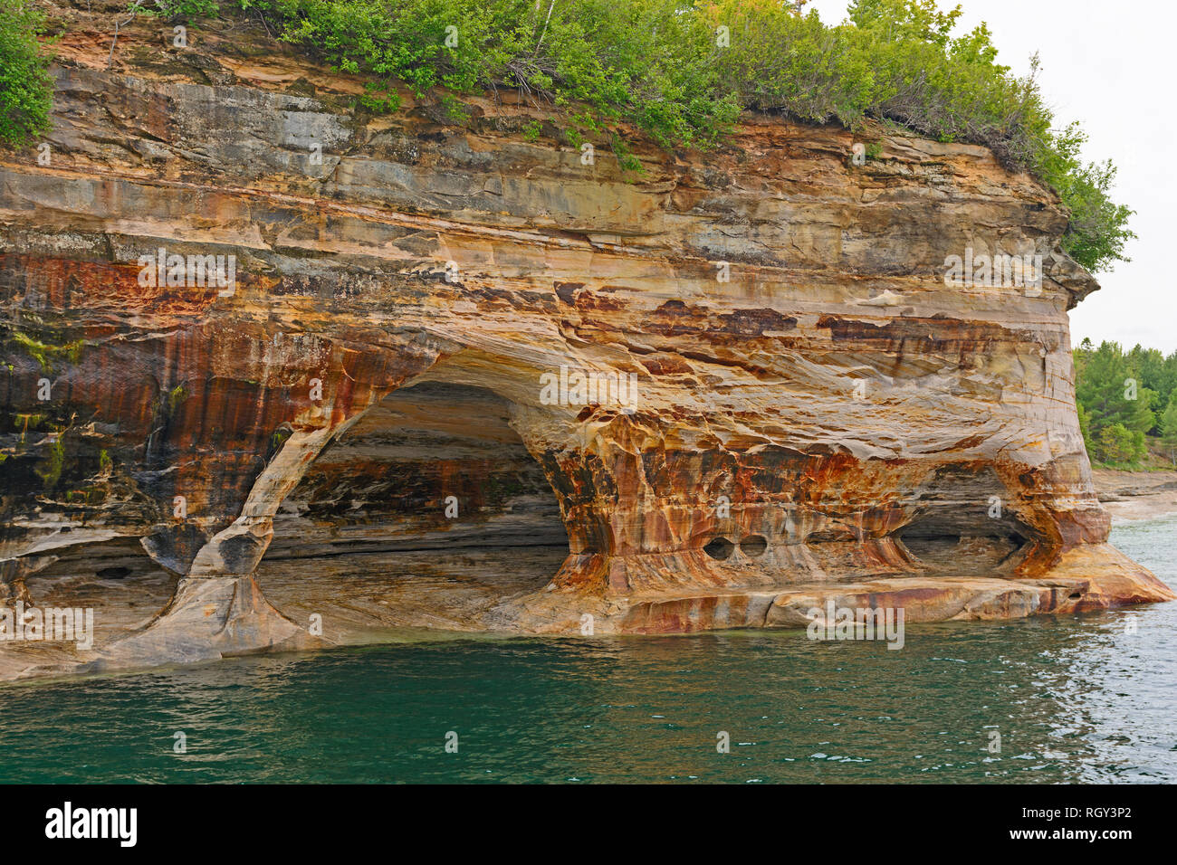 Colorful Sandstone on an Eroded Cliff in Pictured Rocks National Lakeshore in Michigan Stock Photo