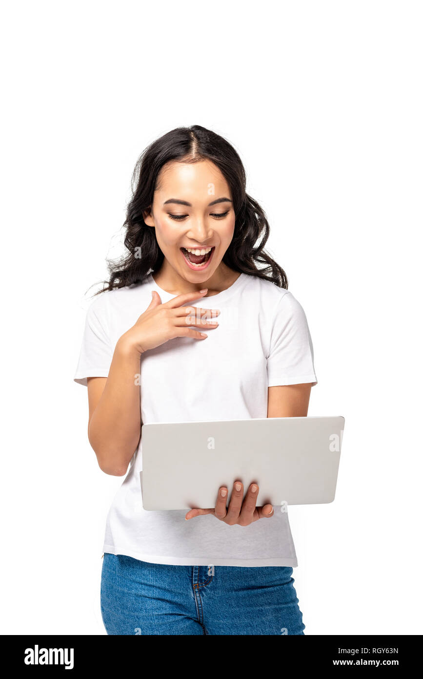 Woman holding laptop to chest hires stock photography and images Alamy