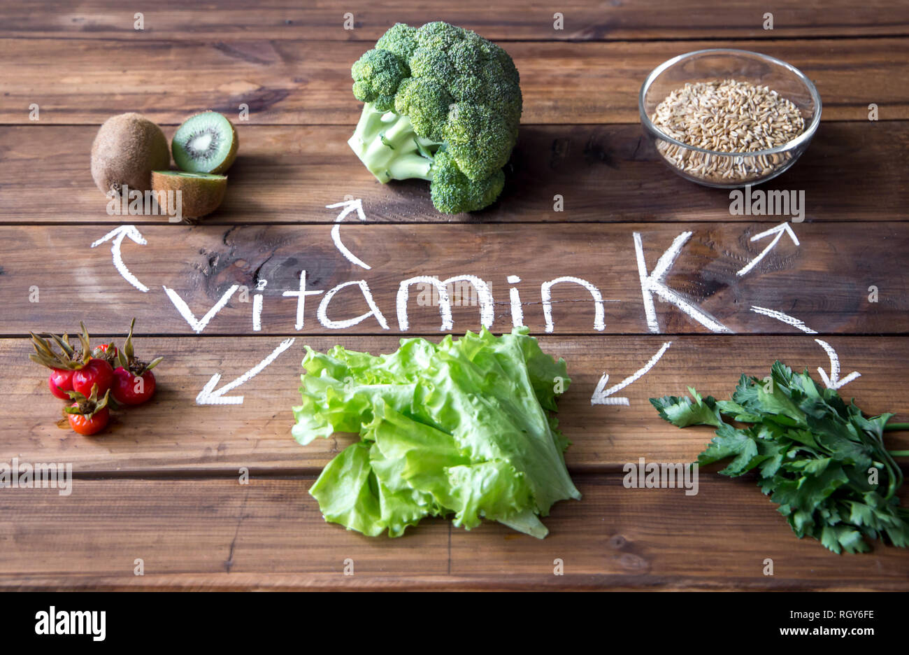 Foods highest in Vitamin K on a wooden board. Healthy eating. Top view