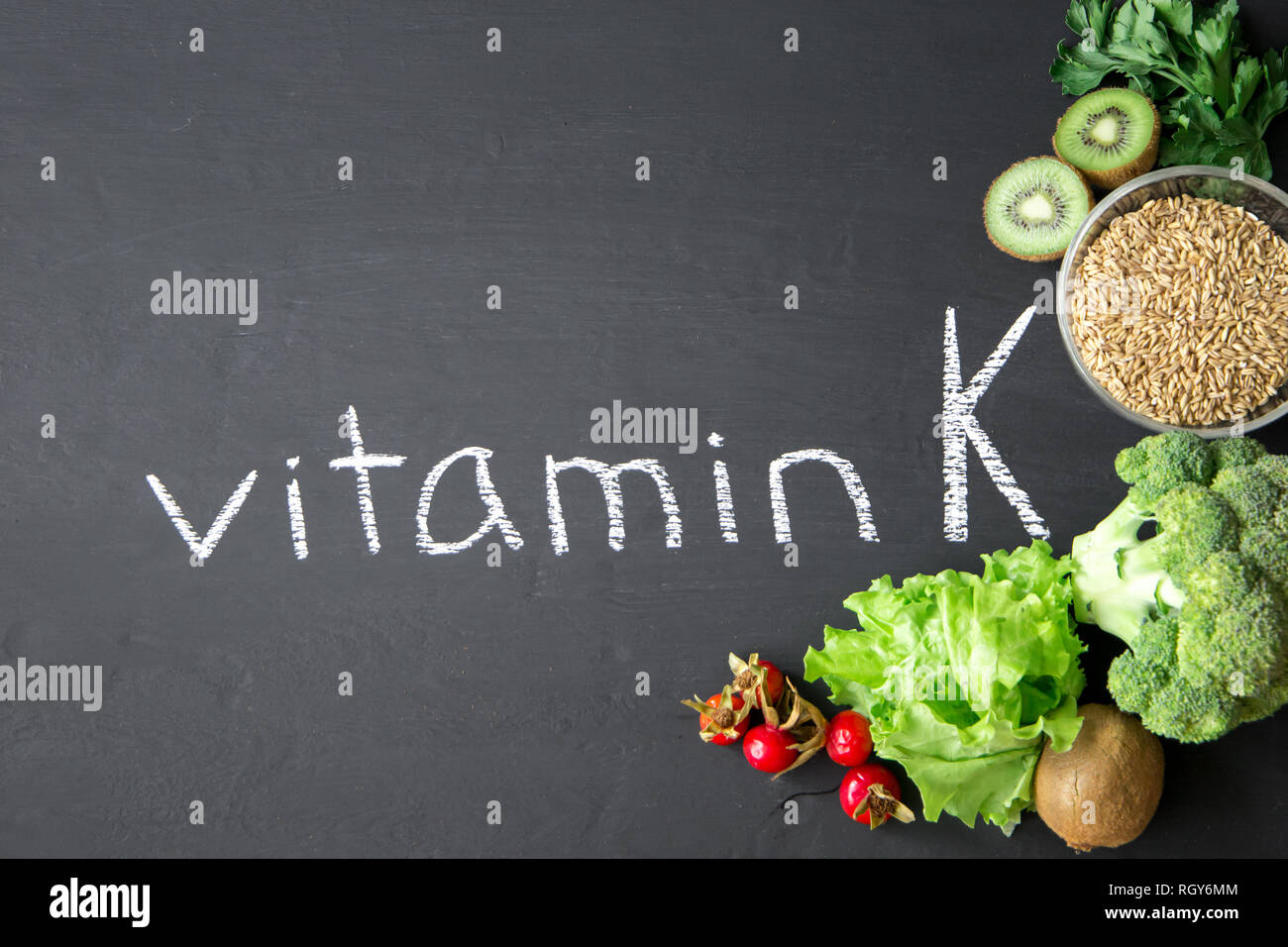 Foods highest in Vitamin K on a chalky board. Healthy eating. Top view