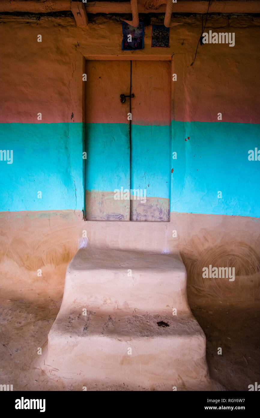 Wooden door and stairs of a traditional house, colorfully painted Stock Photo