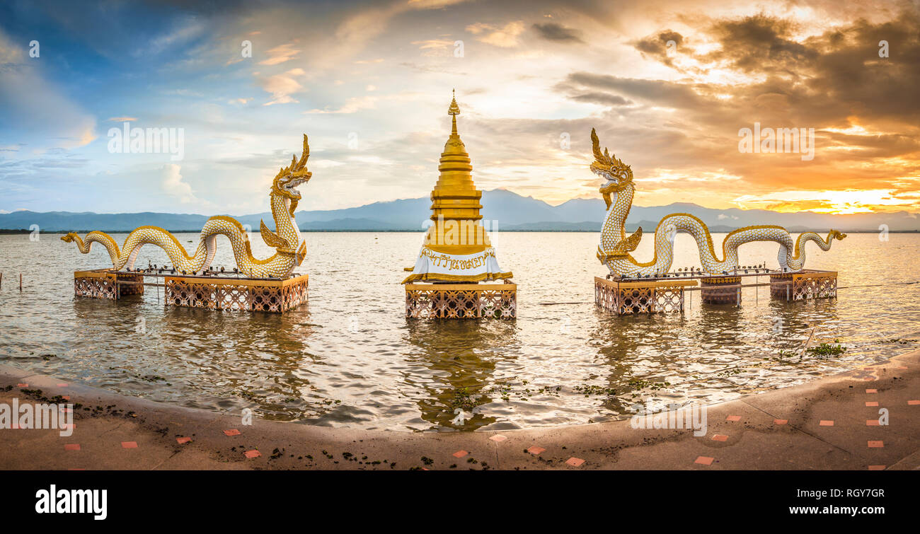 Kwan Phayao, a lake in the province of Phayao, in the North of Thailand, with two white sea snake dragon guardians on the shore Stock Photo
