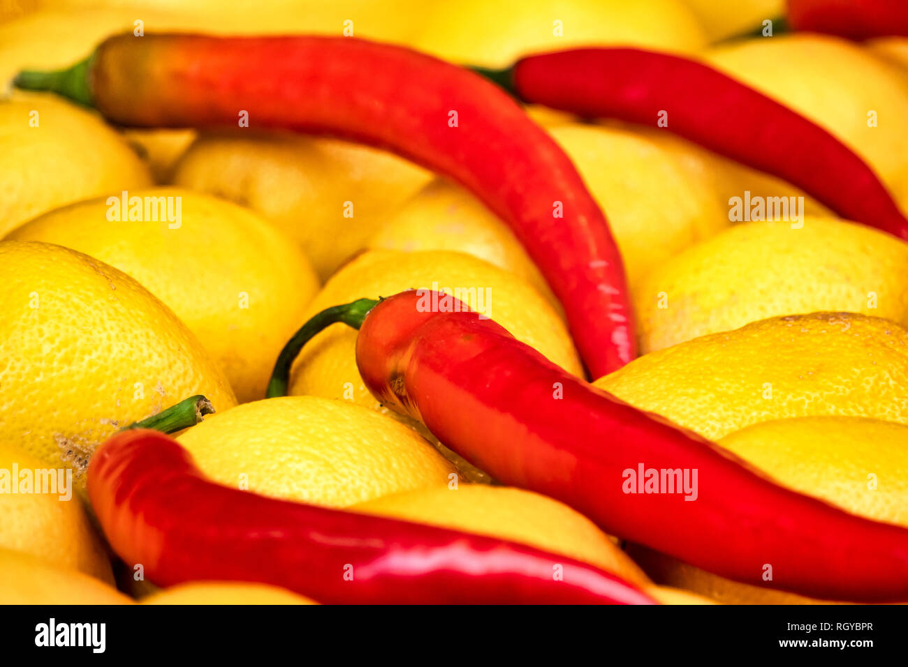 Close up shot of some chili peppers and lemons Stock Photo