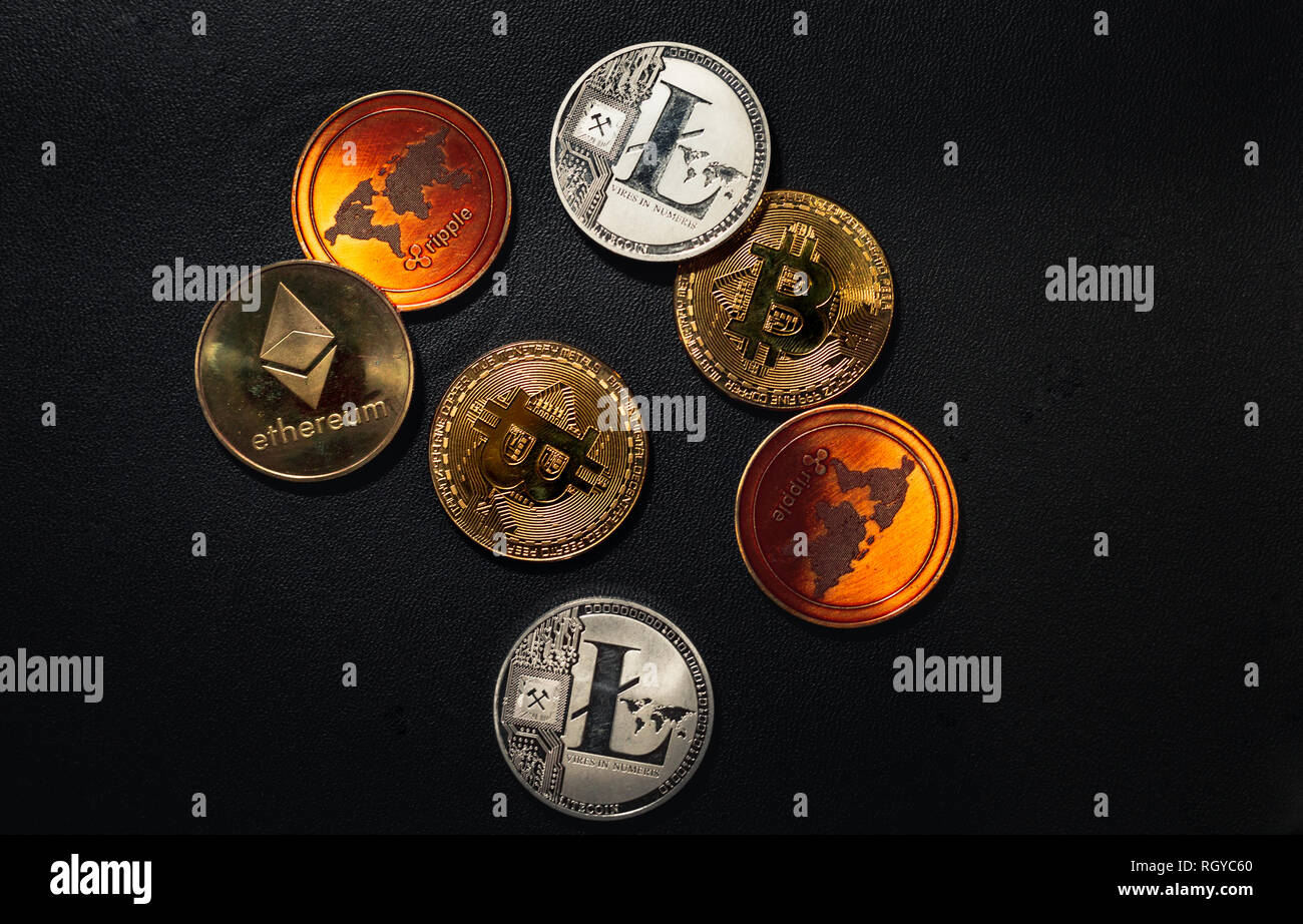 Family of cryptocurrency. Stack of shining golden and silver coins on dark  black background. Crypto group. Shot of Ripple, bitcoin, litecoin and ether  Stock Photo - Alamy