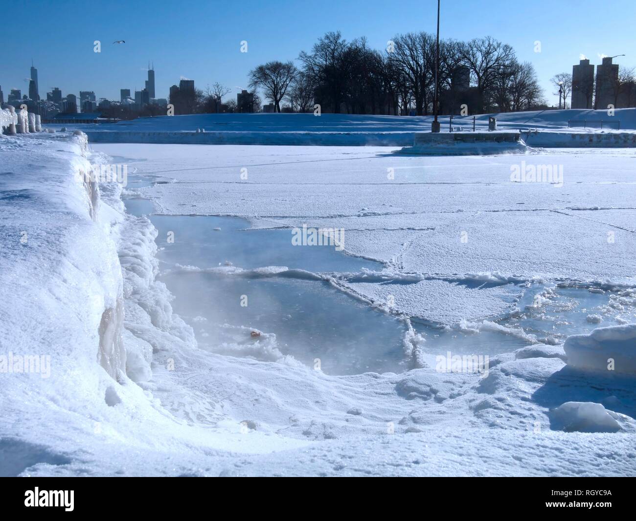Frozen Lake Michigan with sheet of ice and snow during polar vortex in Chicago, Illinois Stock Photo