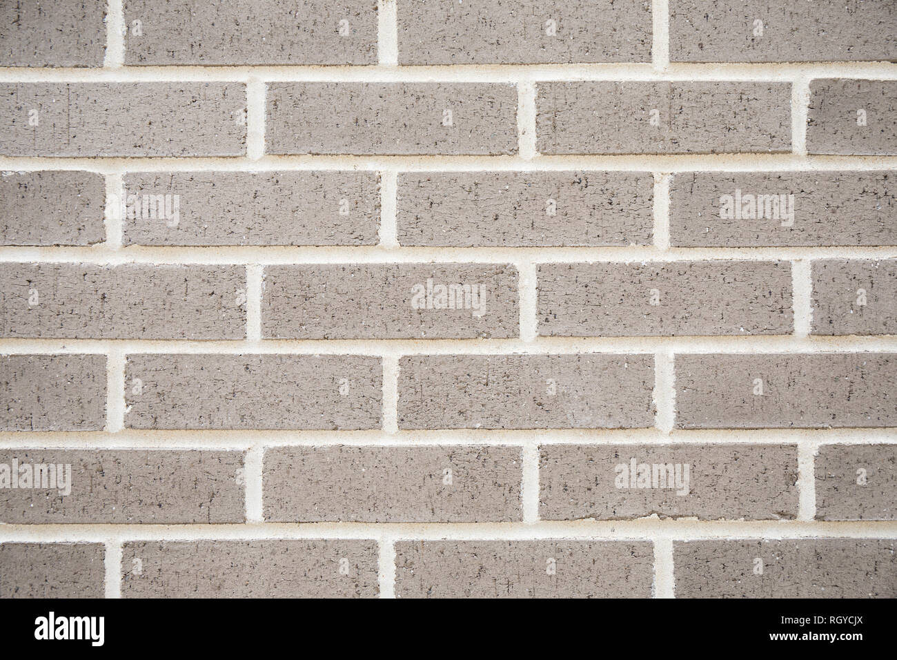 A new grey brick wall for a texture and patterned background. Stock Photo