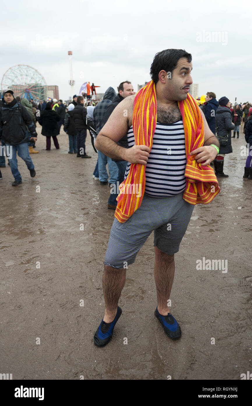 Annual Polar Bear Club New Year's Day plunge into Atlantic Ocean at Coney Island in Brooklyn, NY, Jan.1, 2013. An estimated 2,000 revelers and swimmer Stock Photo