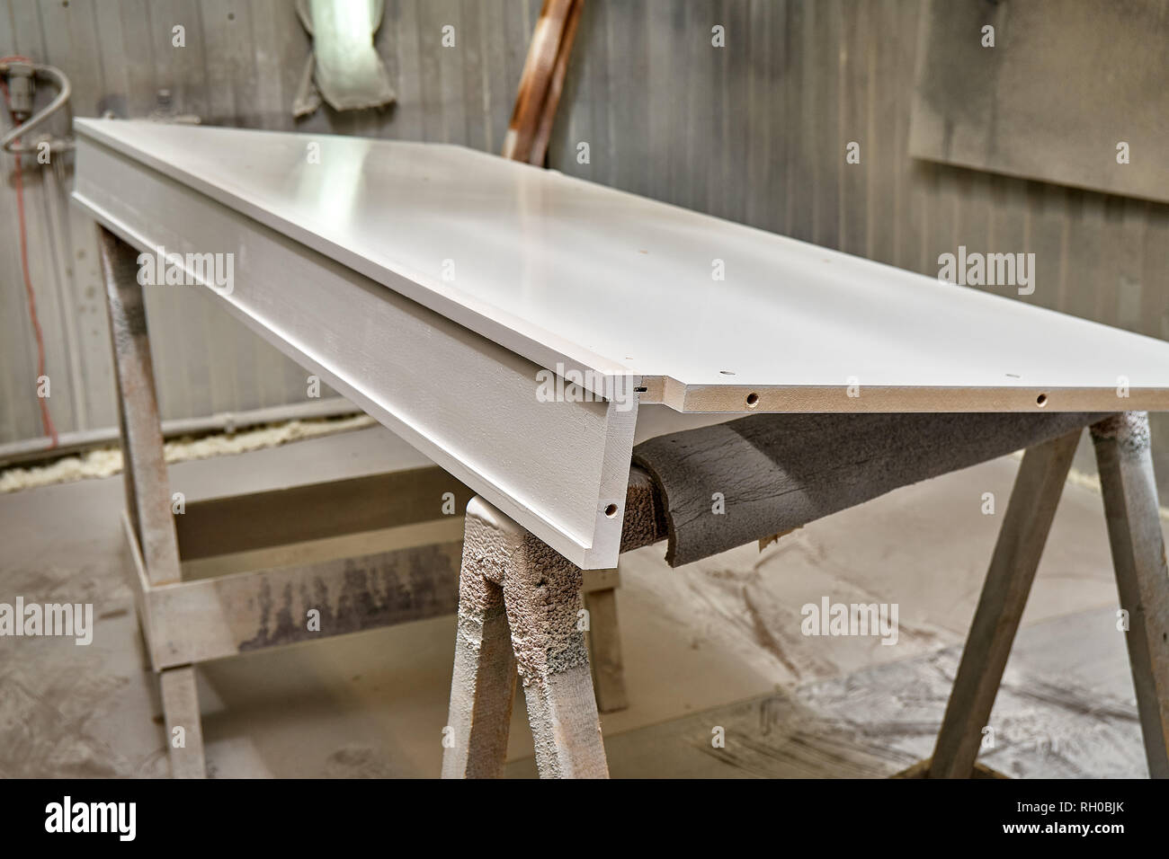 Painting with spray gun. Painting chamber, spray gun. Wooden