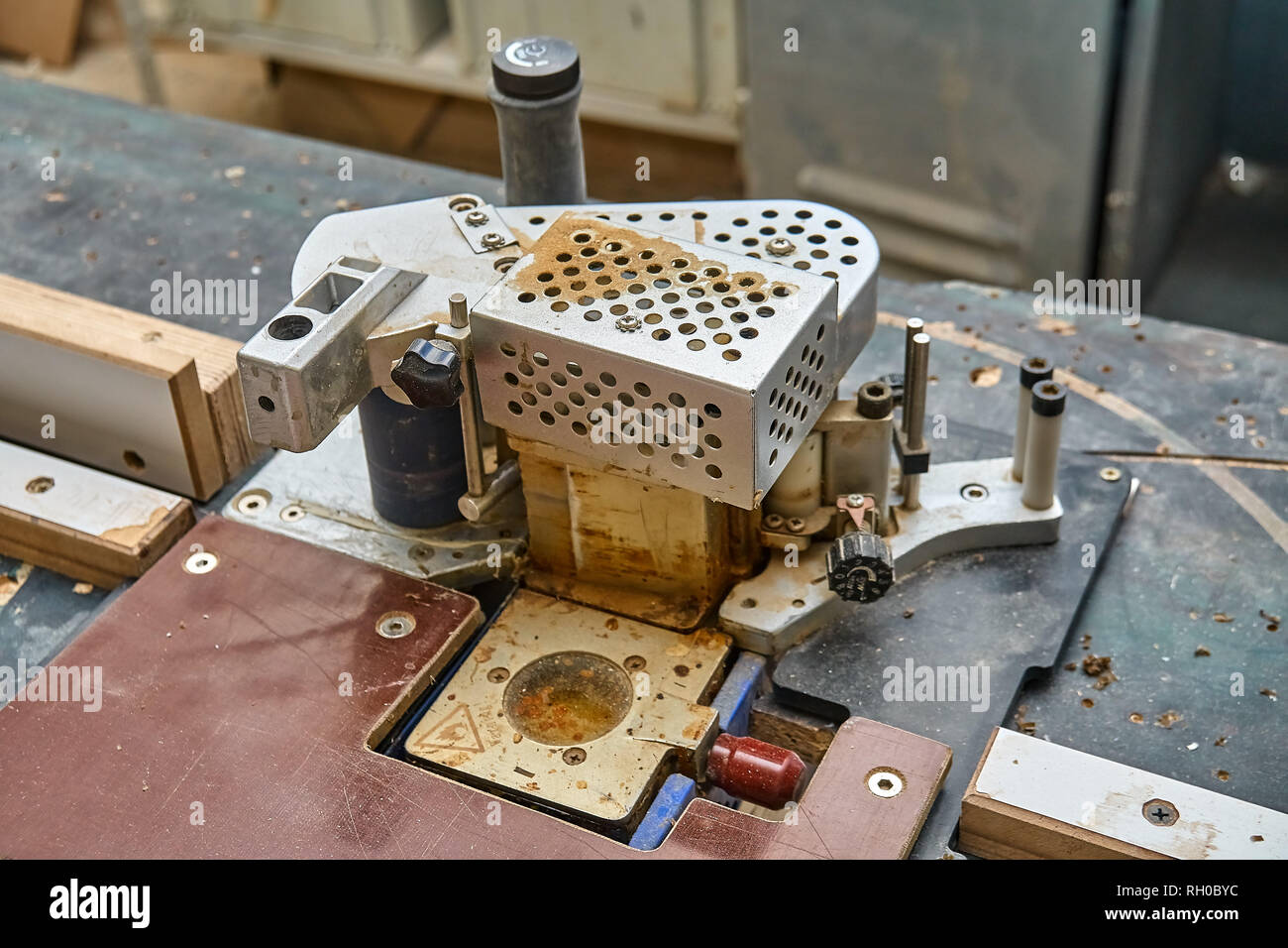 Edge banding machine in the Closeup. Wooden furniture