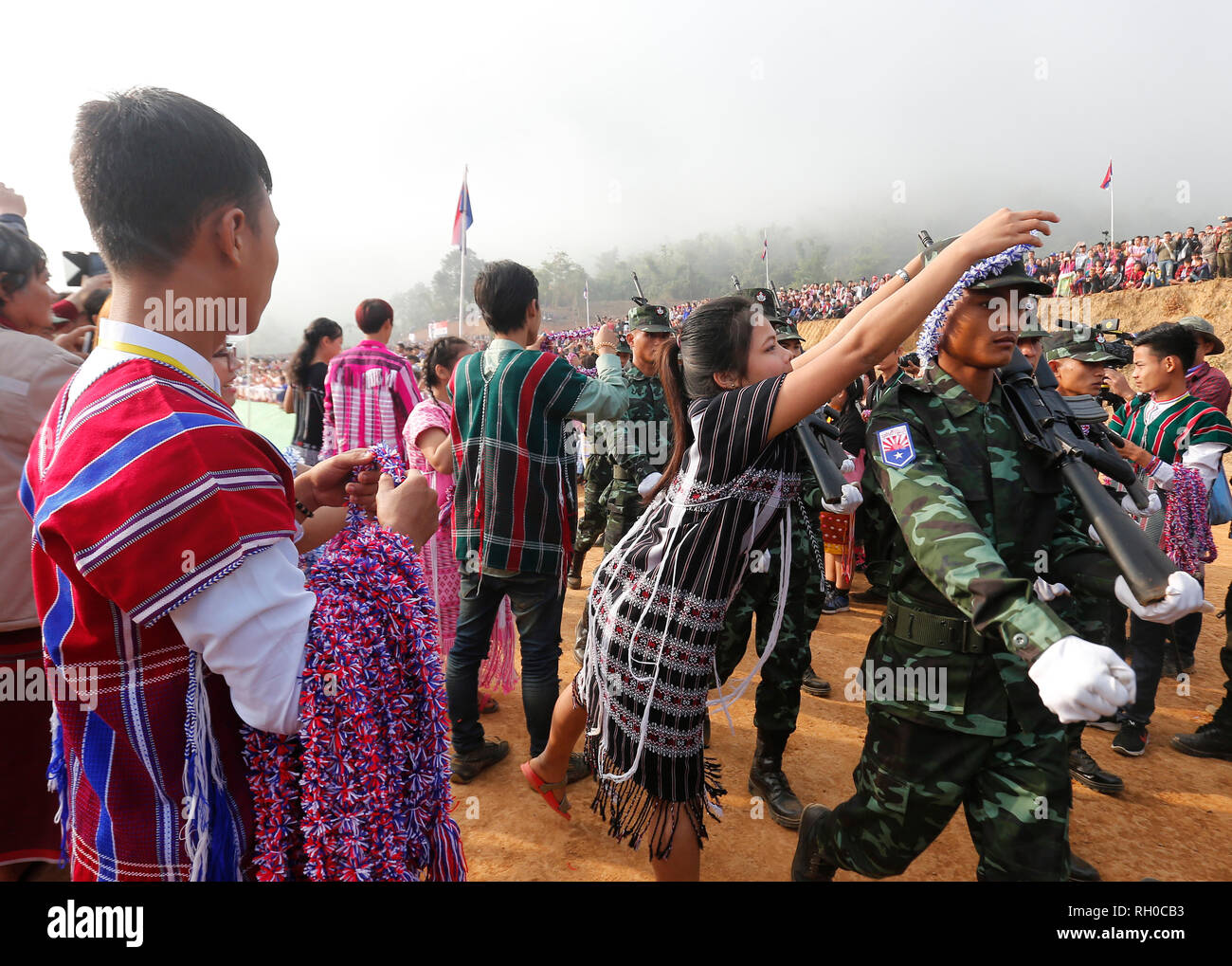 Karen National Union (KNU) soldiers receives a garland from people during a  parade at a ceremony to mark the 70th anniversary of Karen Revolution Day  at Thay Bay Hla in the Karen