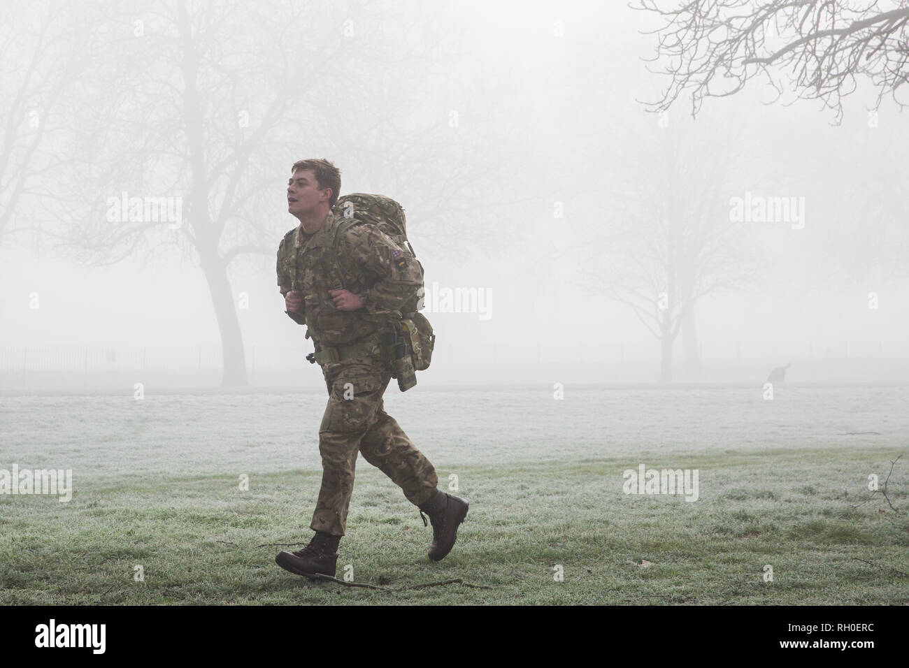 Windsor, UK. 31st January, 2019. UK Weather: Soldiers train with backpacks in frosty and foggy conditions alongside the Long Walk in Windsor Great Park. There are two barracks in Windsor, the Victoria Barracks which currently houses the 1st Battalion Coldstream Guards and the Combermere Barracks which houses the Household Cavalry Regiment. Freezing fog patches are expected to clear slowly in south-east England during the morning, to be followed by cloud, sleet and snow in the east. Credit: Mark Kerrison/Alamy Live News Stock Photo