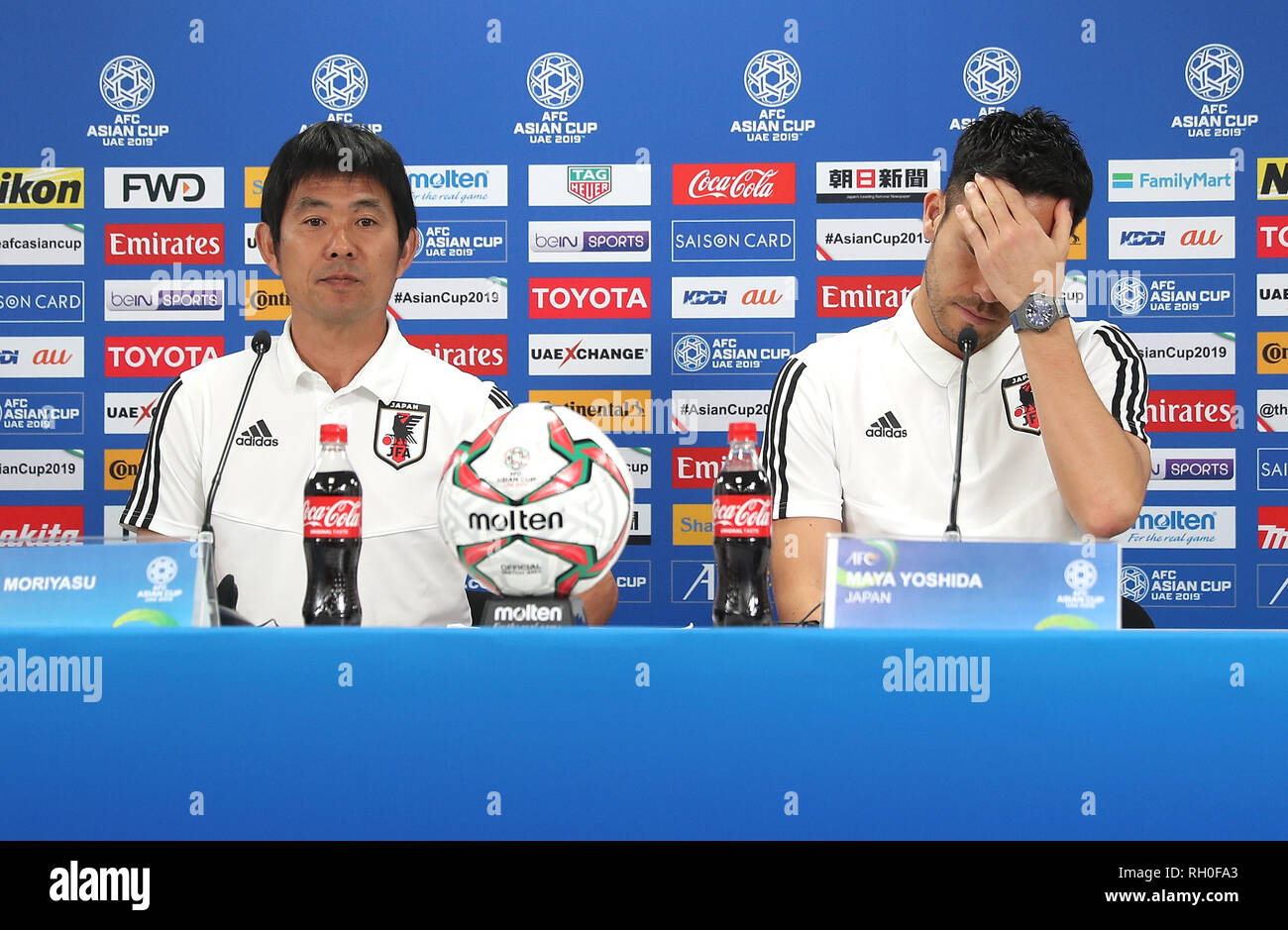 Abu Dhabi, United Arab Emirates (UAE). 31st Jan, 2019. Japan's head coach Hajime Moriyasu (L) and player Maya Yoshida react during the press conference before the final match between Qatar and Japan at the 2019 AFC Asian Cup in Abu Dhabi, the United Arab Emirates (UAE), Jan. 31, 2019. Credit: Cao Can/Xinhua/Alamy Live News Stock Photo