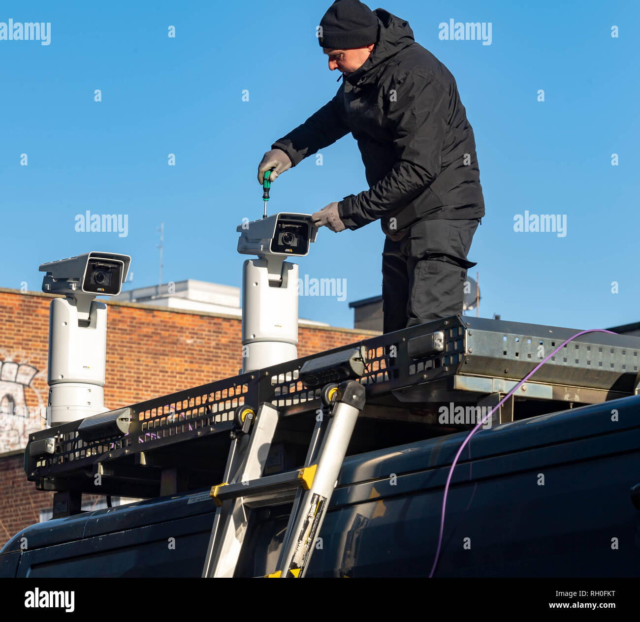 Romford, Essex, UK. 31st January 2019 Metropolitan Police trial live Facial recognition technology outside Romford Station. The police cameras scan passers by and check them against a 'watch list' in real time allowing them to apprehend any wanted people. A small number of protesters against the scheme protested outside Romford Station. Credit: Ian Davidson/Alamy Live News Stock Photo