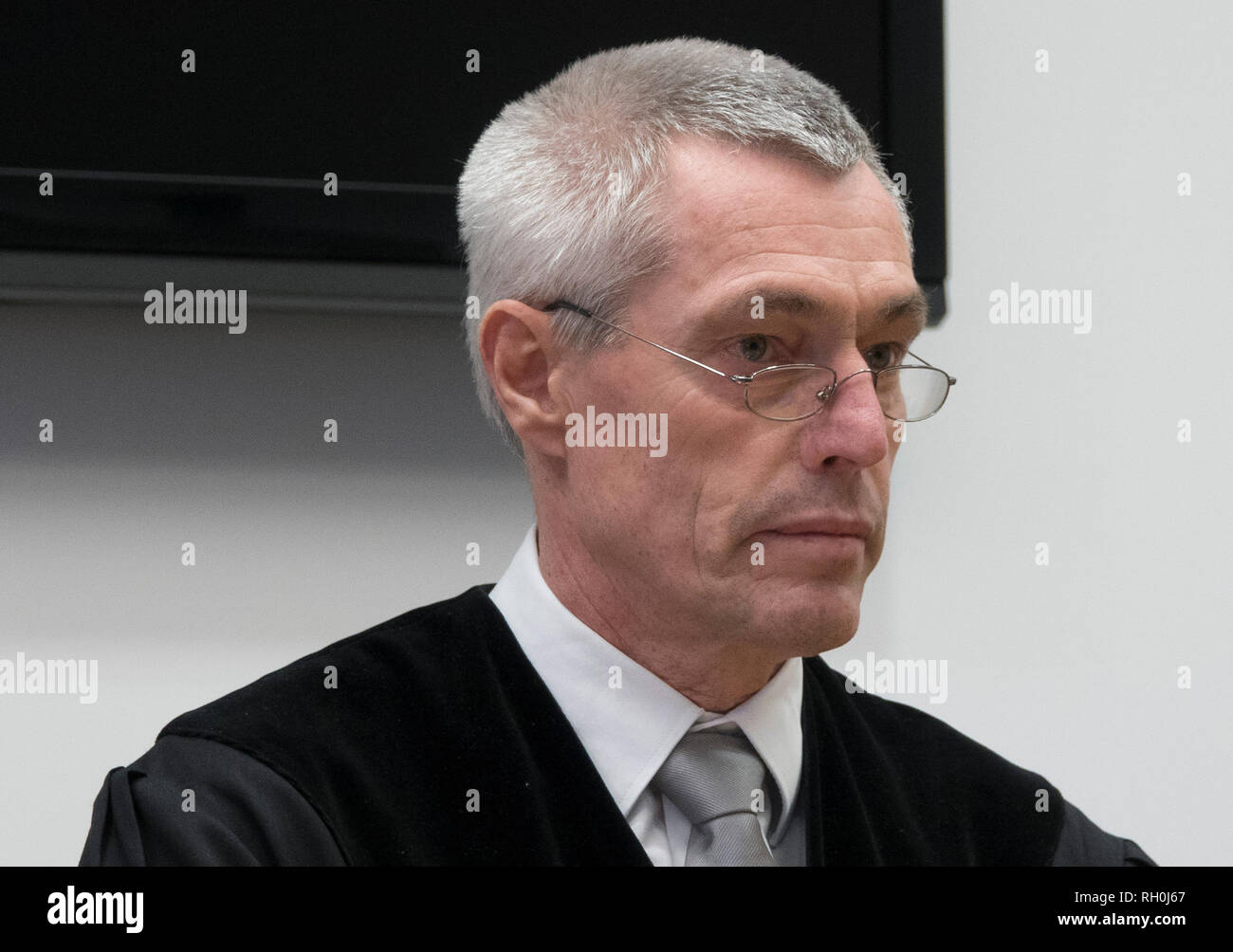 Hanau, Germany. 31st Jan, 2019. Peter Graßmück, presiding judge at the regional court, is about to pronounce a verdict against a 35-year-old woman in his seat in the courtroom. The woman was sentenced to life in prison for murder. Credit: Monia Mersni/dpa/Alamy Live News Stock Photo