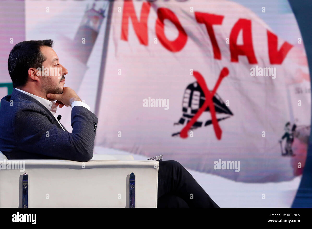Matteo Salvini and on the screen flags with TAV (TAV is special-purpose entity owned by RFI (itself owned by Ferrovie dello Stato) for the planning and construction of a high-speed rail network in Italy) Rome January 31st 2019. The Italian Minister of Internal Affairs appears as a guest on the tv show Porta a Porta Foto Samantha Zucchi Insidefoto Stock Photo