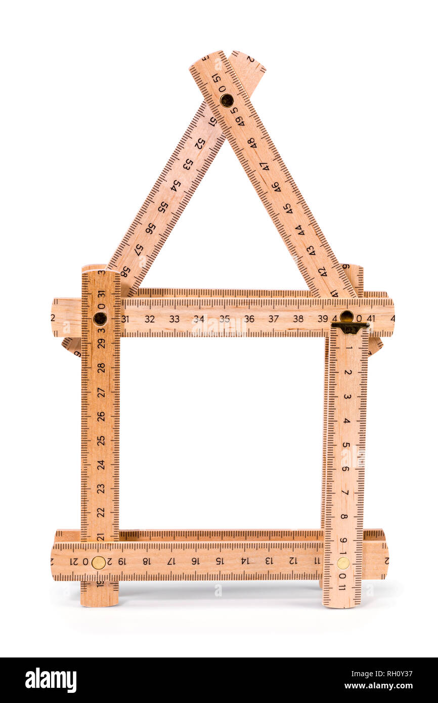 Wooden folding meter ruler in the shape of two house. Isolated on white