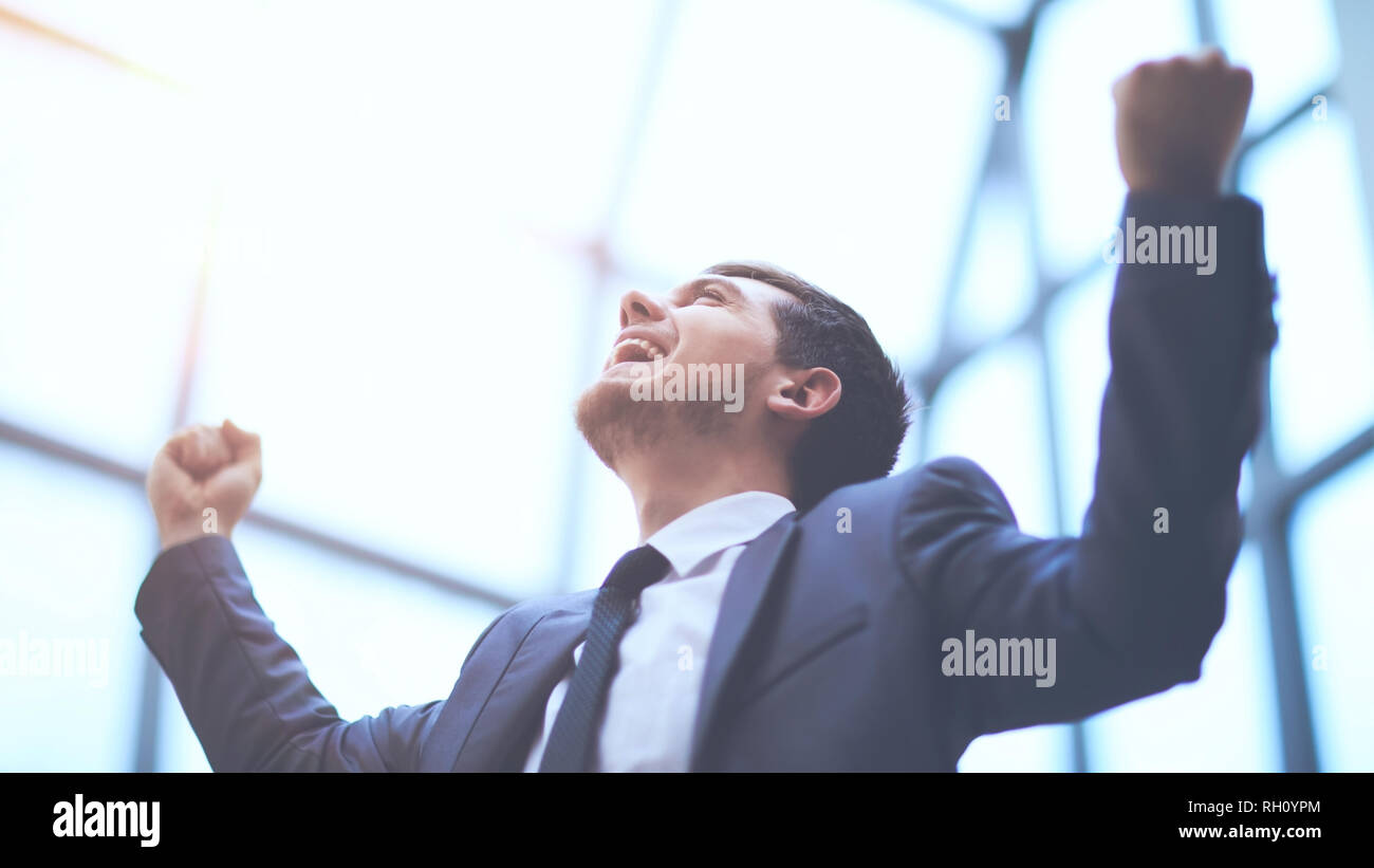 Successful businessman with arms up celebrating his victory Stock Photo ...