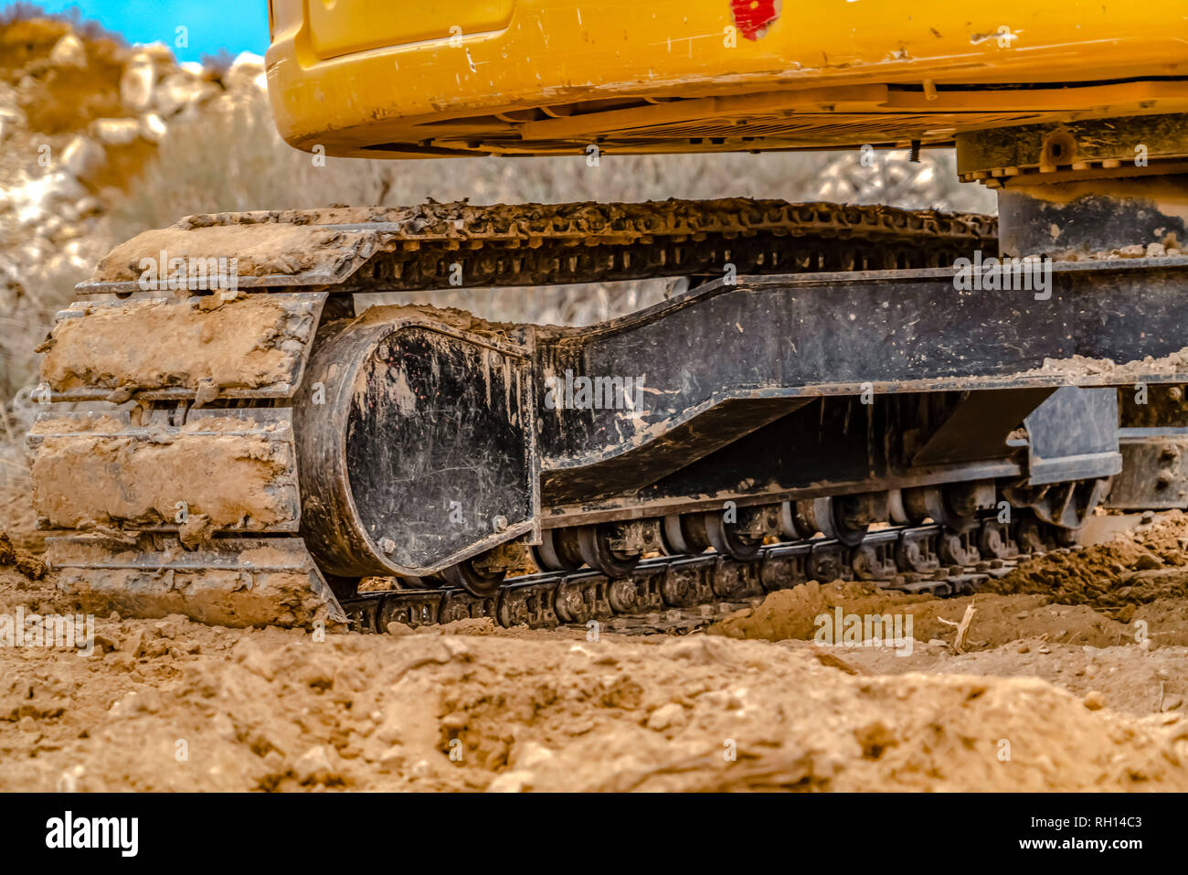 Excavator with caked dirt on its track pad in Utah Stock Photo