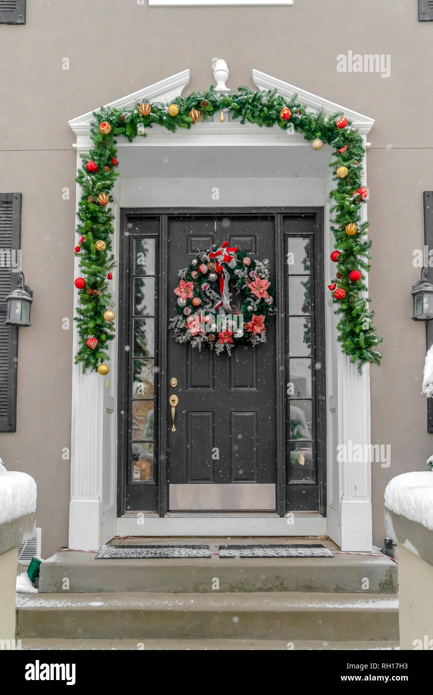 Festive Doorway Decorated With Garland And Wreath Stock