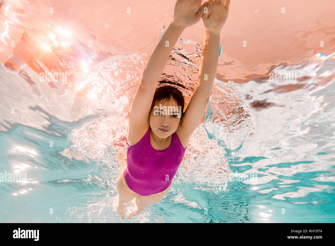 attractive woman swimming underwater in swimming pool Stock Photo - Alamy