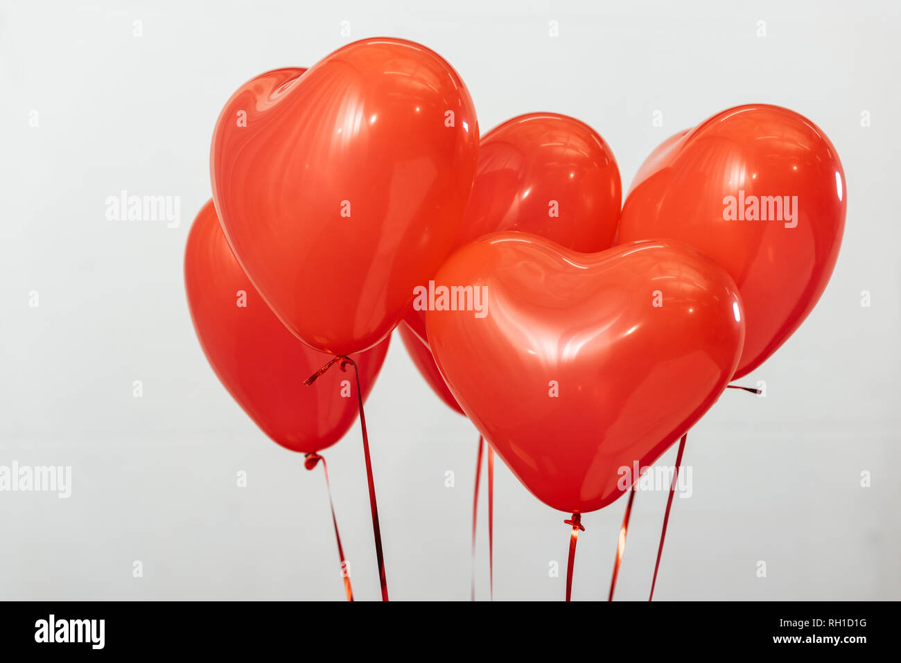 Red heart balloons for valentine day isolated on white Stock Photo - Alamy