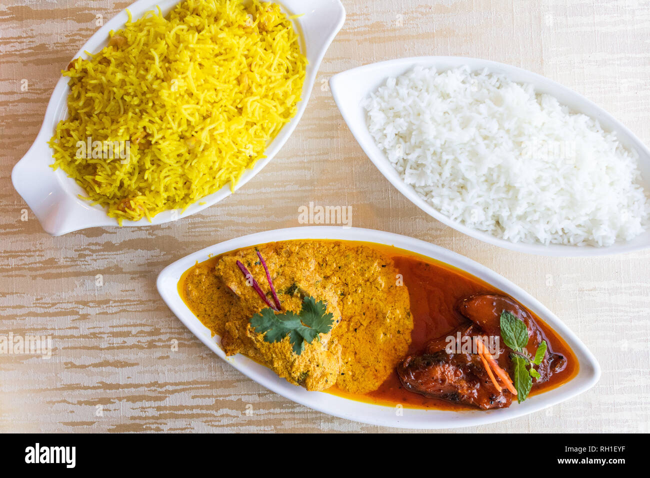 Katla Macher Jhal is a famous bengali fish curry served in two contrasting gravies-one sweetly pungent and the other spicy and tangy Stock Photo